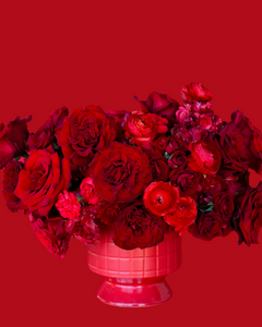 All red flower arrangement in red vase